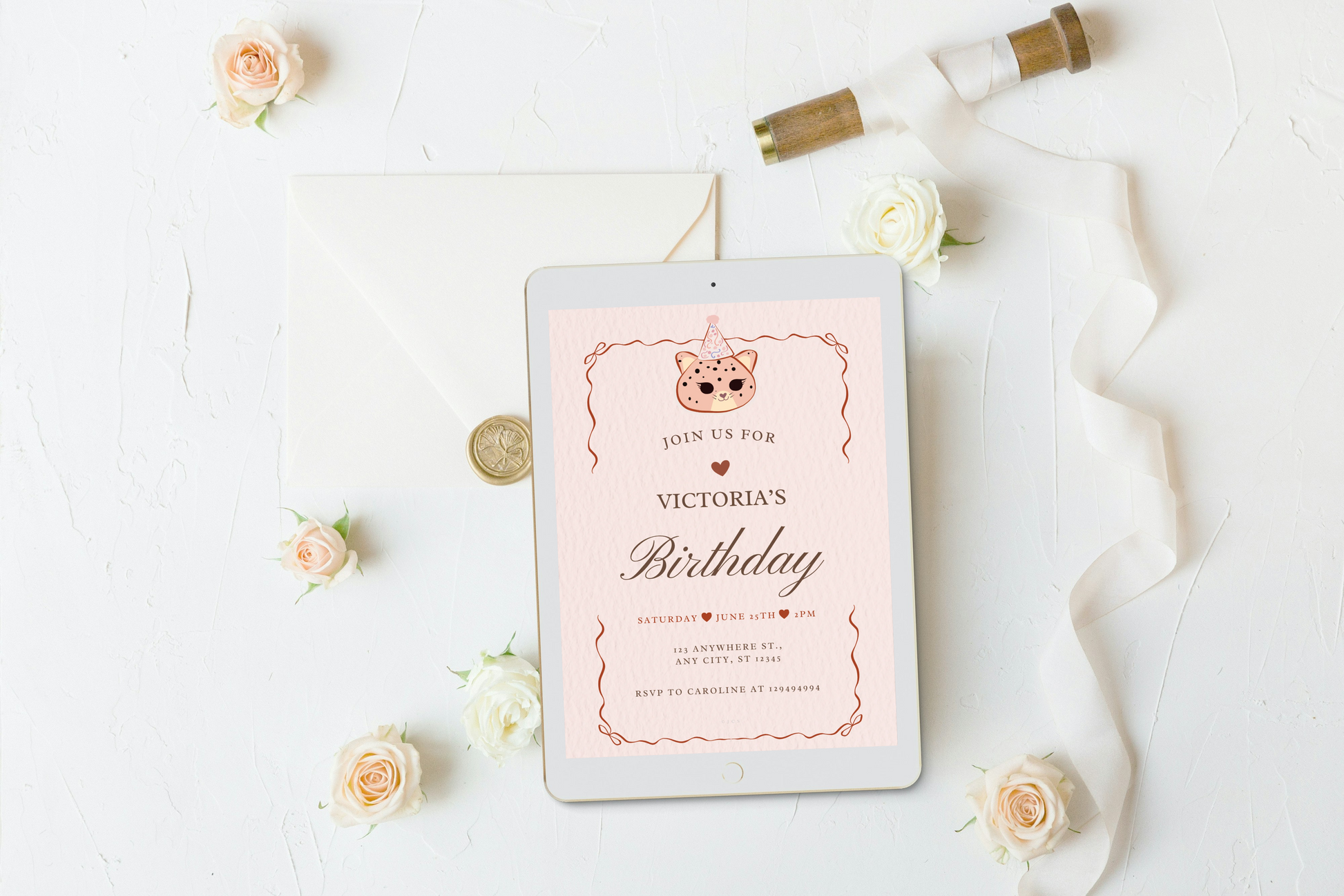A birthday invitation card with a cute pink background. The card has a pale pink background with a cute cat illustration wearing a party hat at the top, decorative copper-toned border lines, and the text 'JOIN US FOR VICTORIA'S Birthday' with event details below.