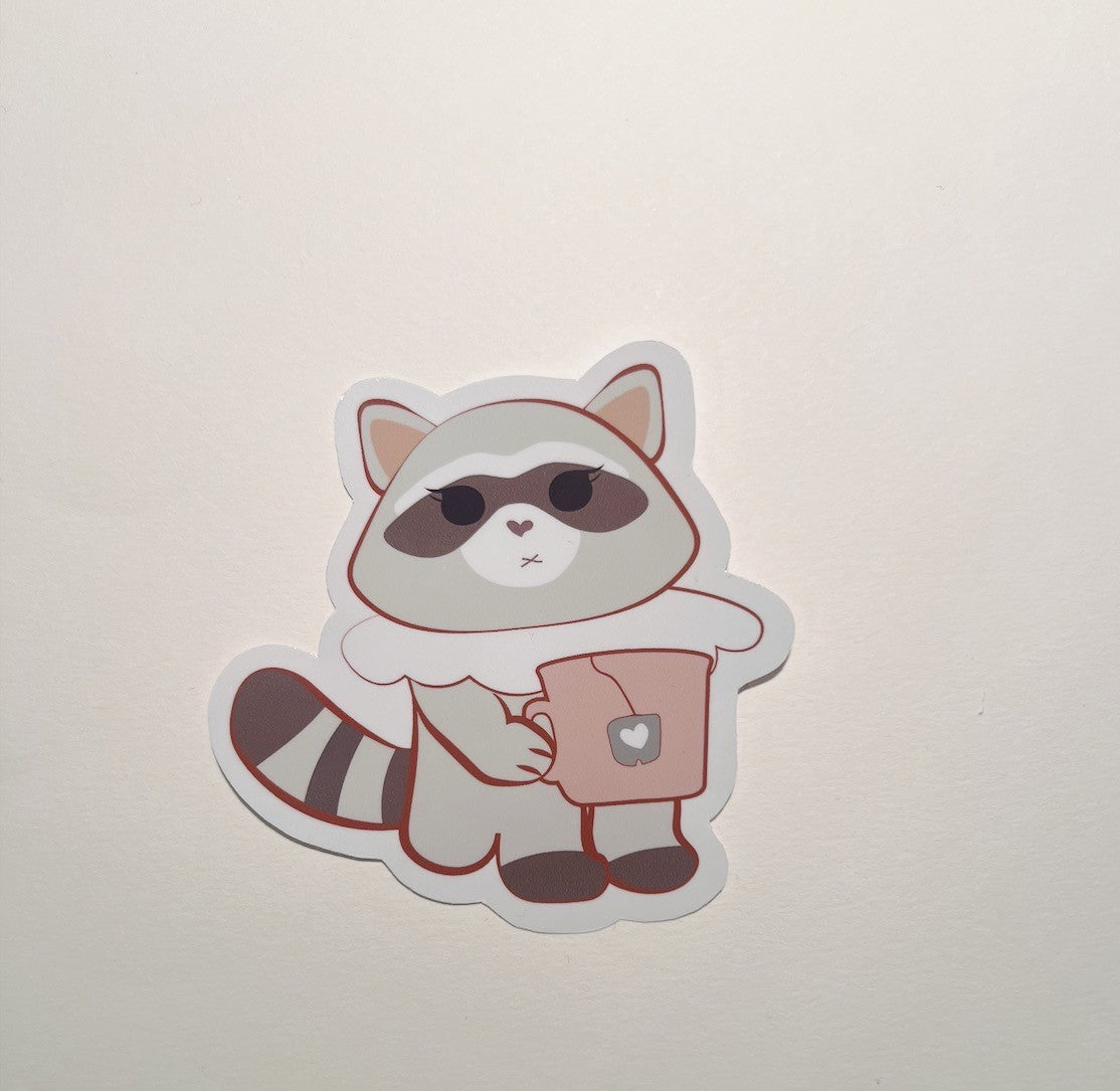 Sticker of a raccoon character holding a coffee cup on a light beige background